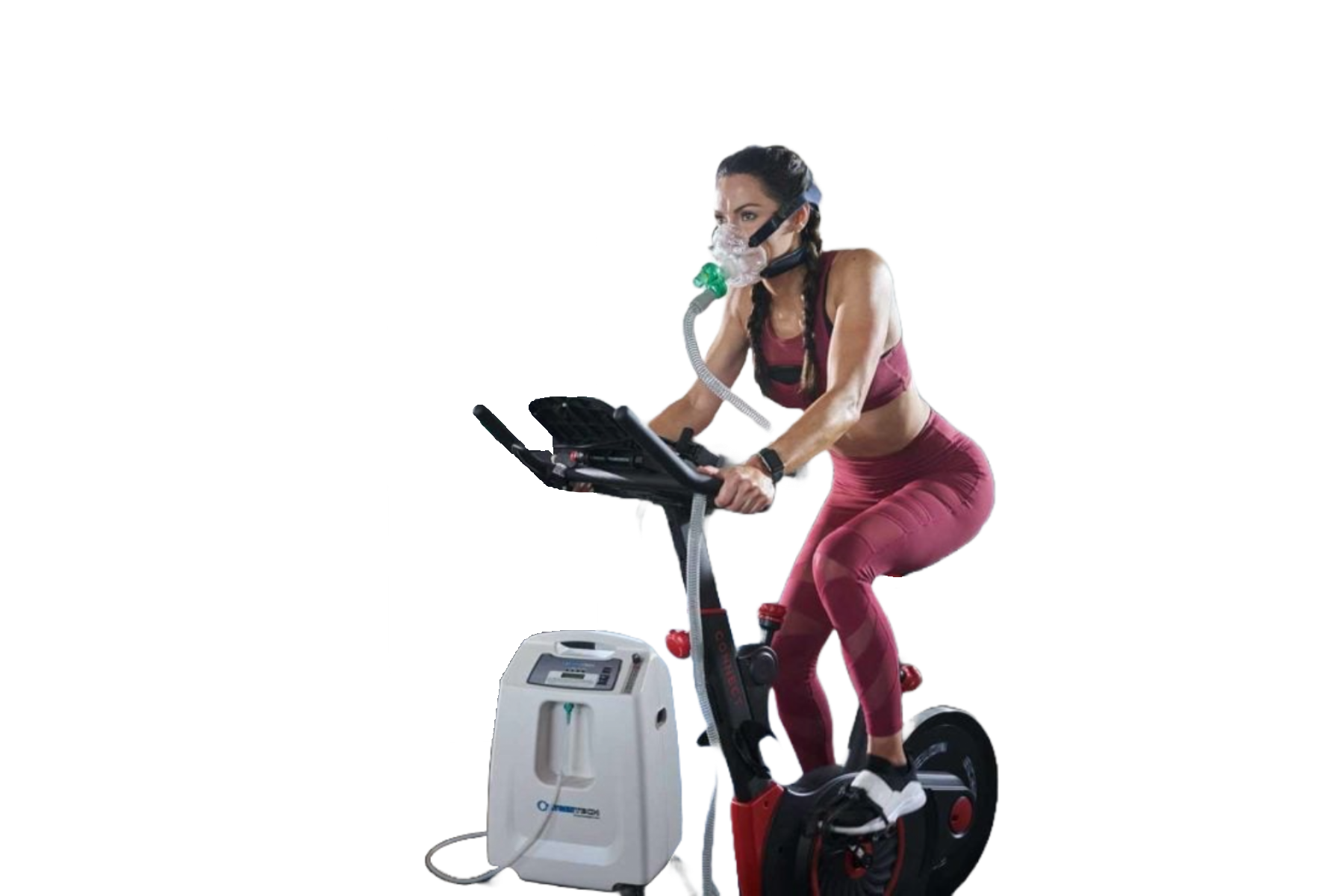 Woman wearing oxygen mask, exercising on stationary bike, connected to an oxygen concentrator.