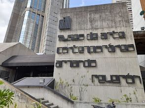 A large concrete sign on the side of a building.