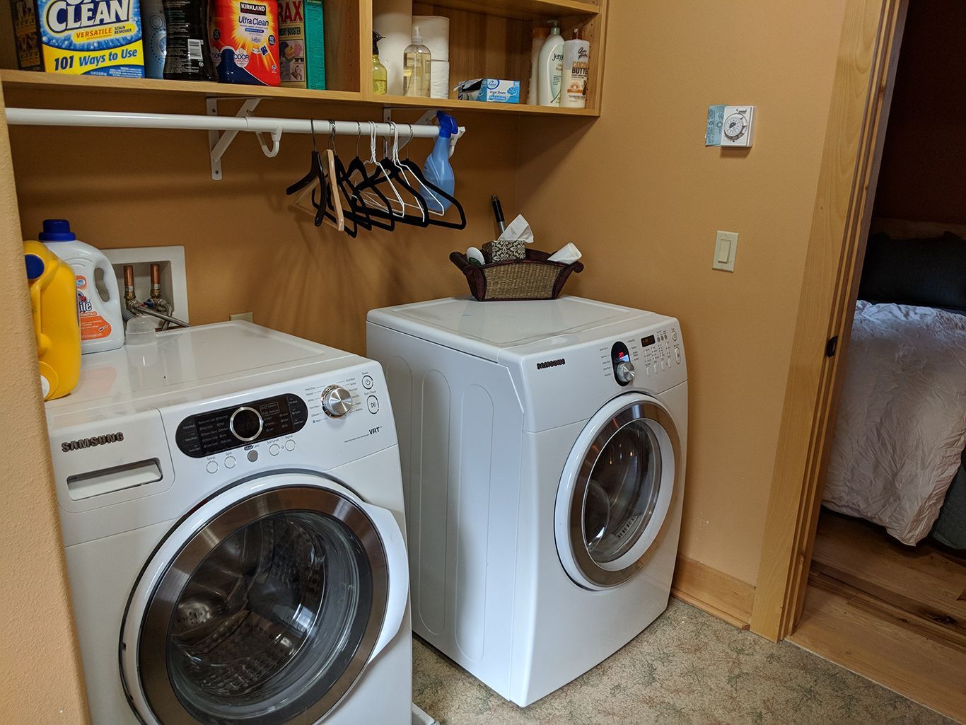 A laundry room with a washer and dryer in it.