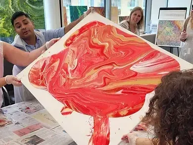 In-person acrylic pouring art team building workshop
