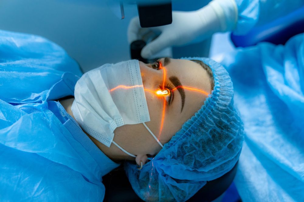 A woman is getting eye surgery in a hospital