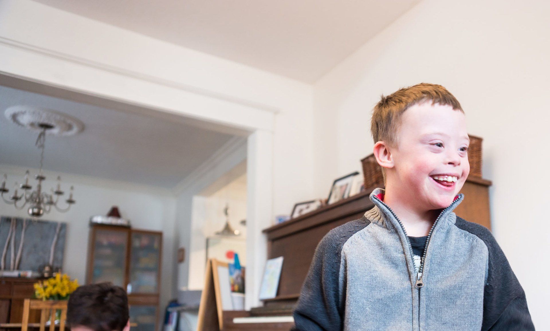 man with down syndrome on tablet