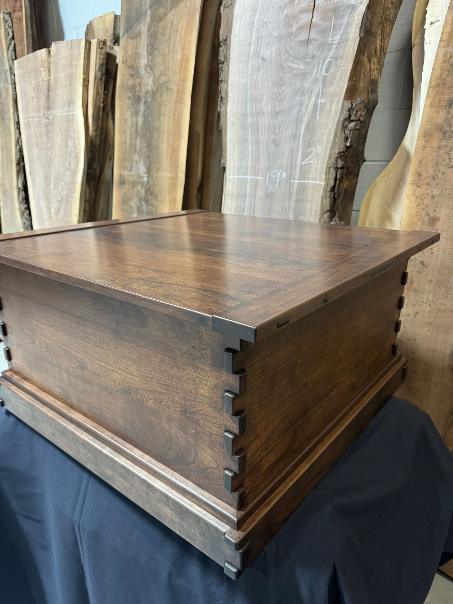 A large piece of wood is sitting on top of a table.