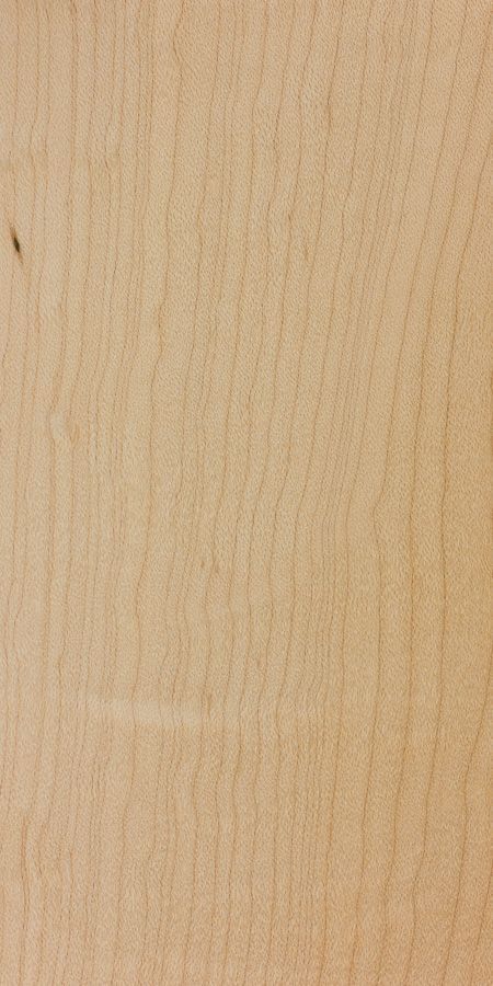 A close up of a piece of wood with a grainy texture.