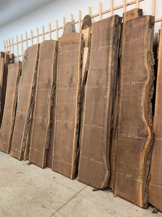 A row of wooden boards sitting next to each other in a room.