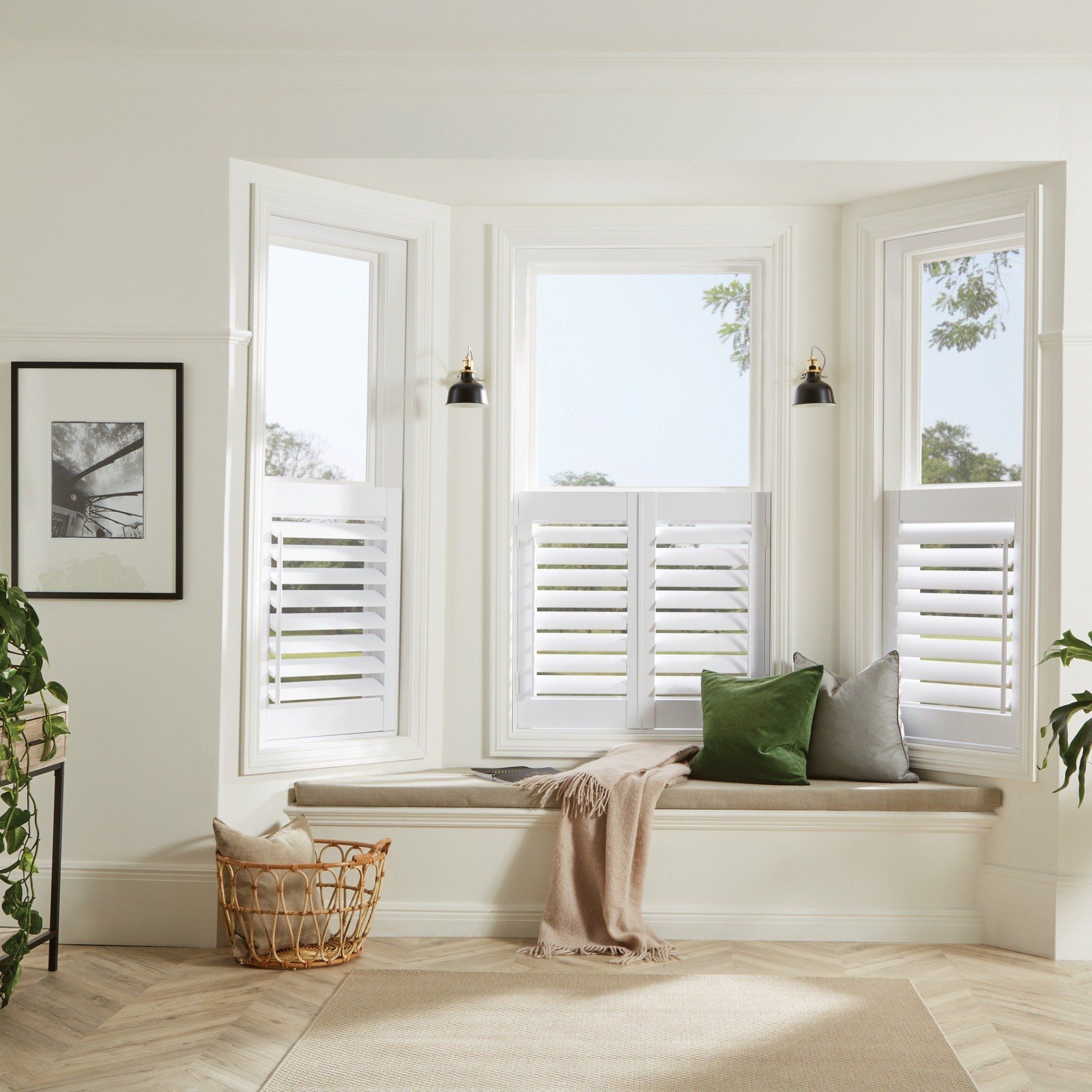 A living room with a window seat and shutters