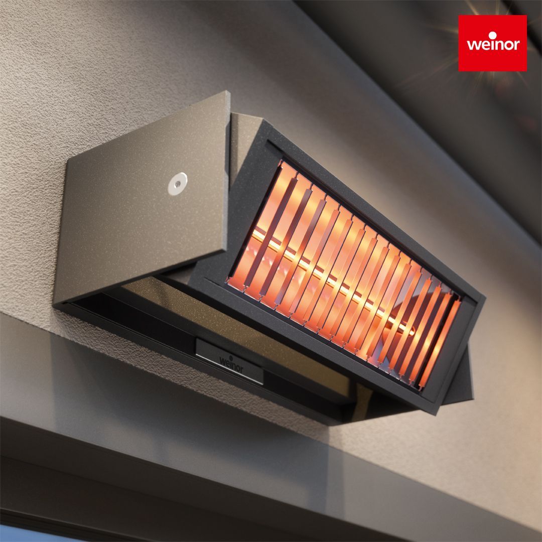 A weiner brand heater is hanging on a wall