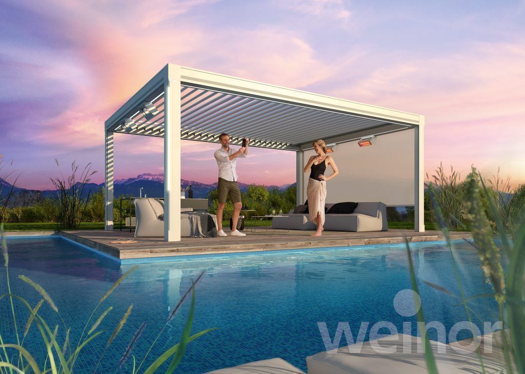 A man and a woman are dancing under a pergola next to a swimming pool.