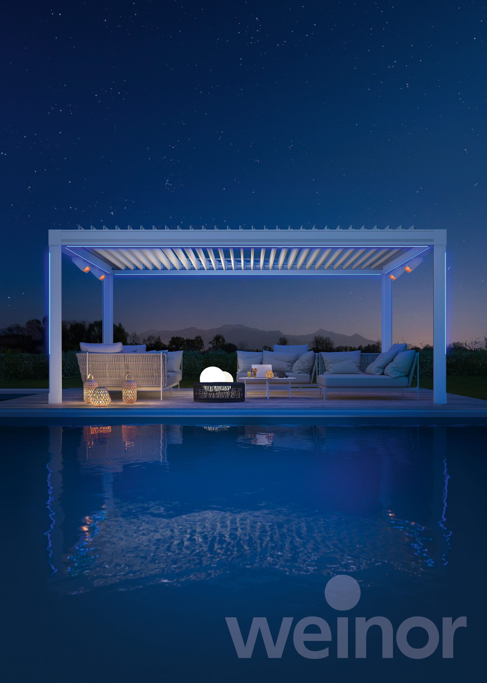 A pergola is sitting next to a swimming pool at night.