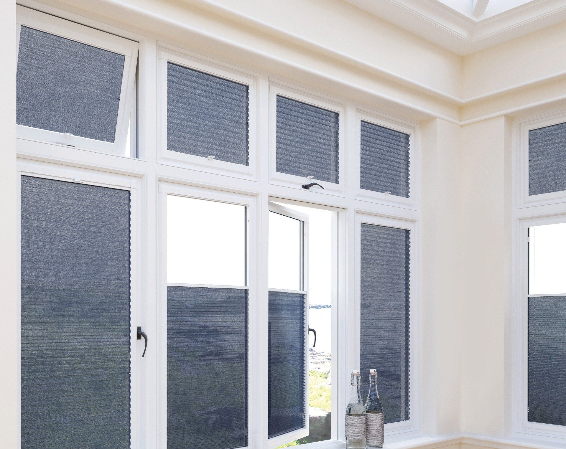 A room with a lot of windows and blinds on them
