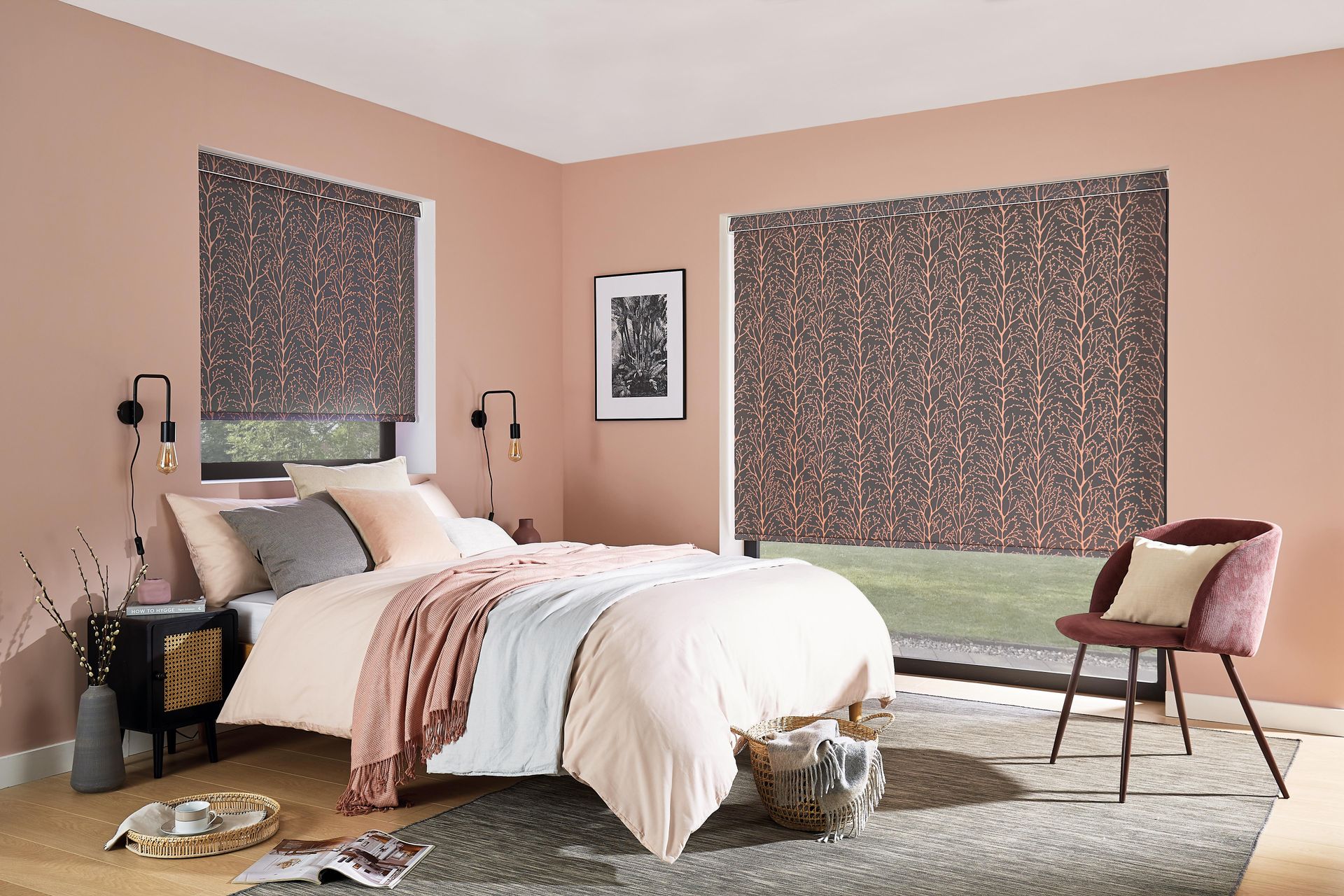 A bedroom with a bed , chair , nightstand and window.