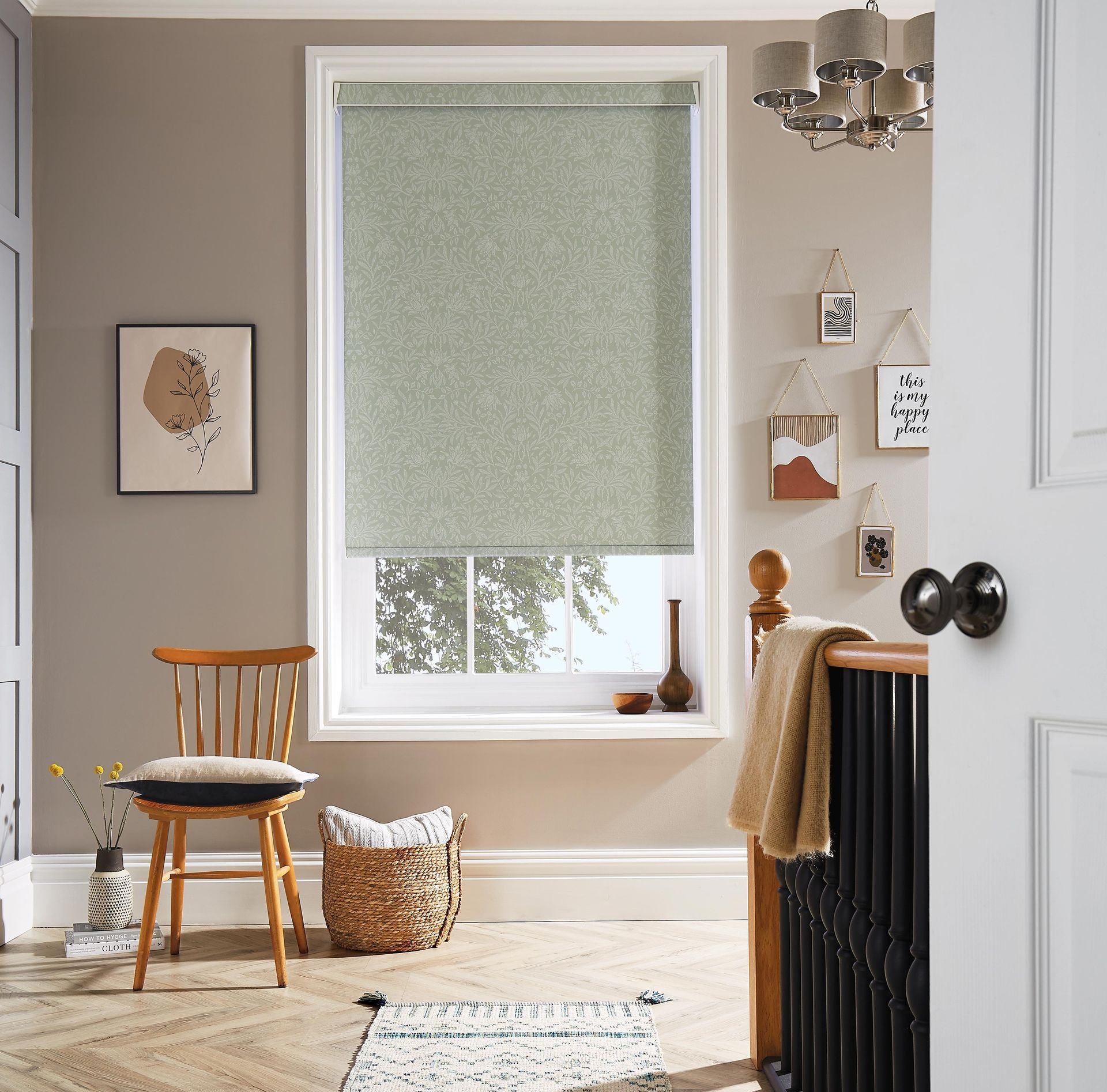 A room with a chair and a window with a blind on it