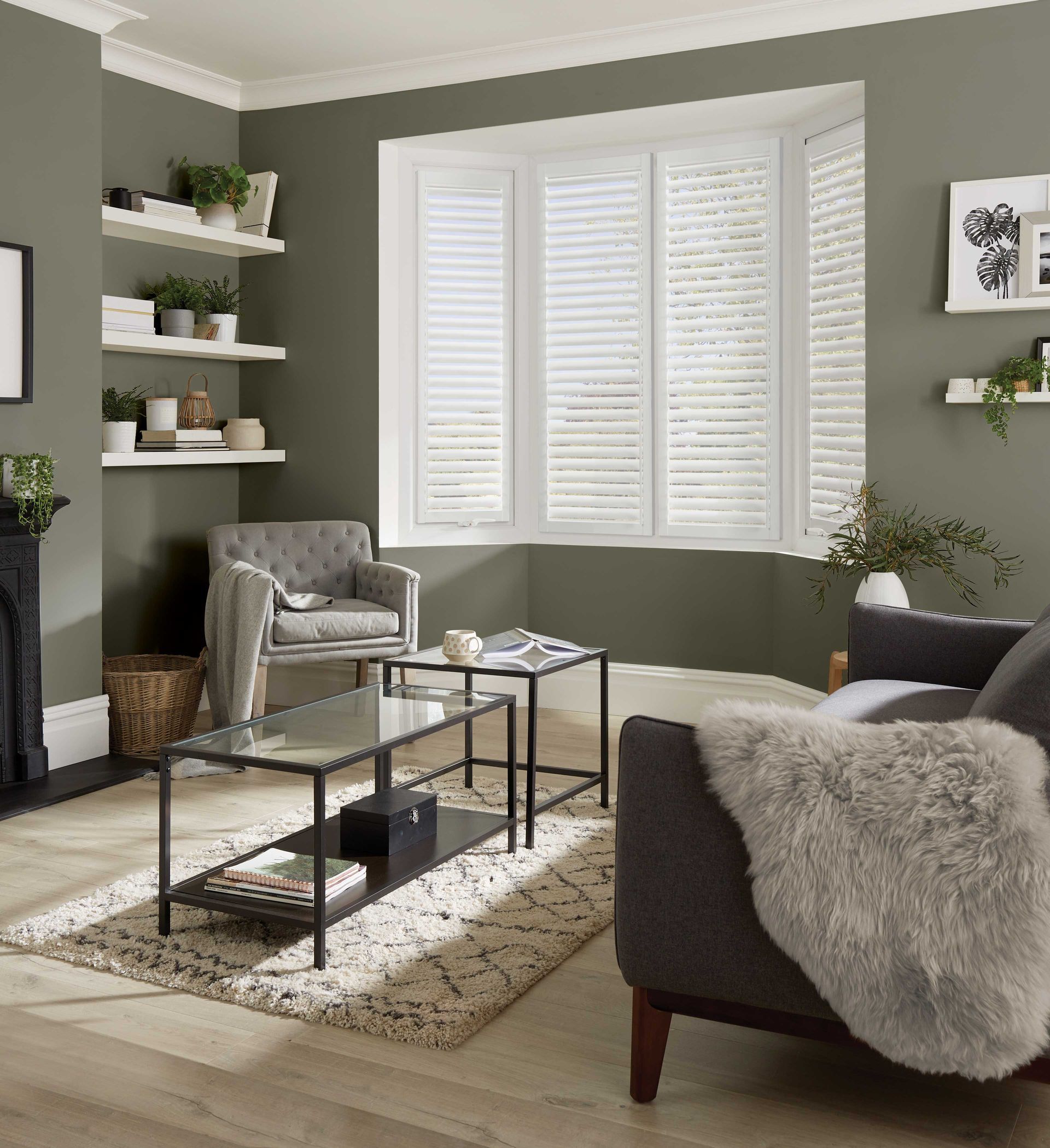 A living room with a couch a chair and a coffee table