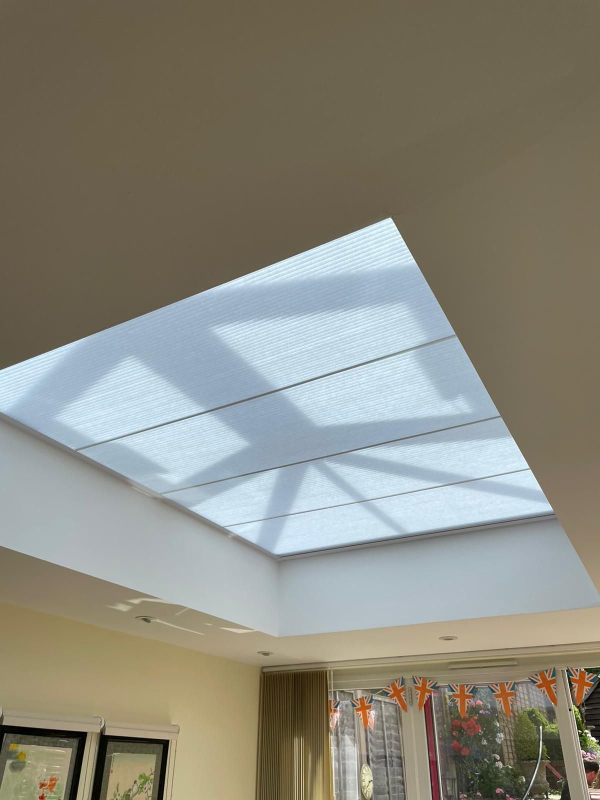 There is a skylight in the ceiling of the room.