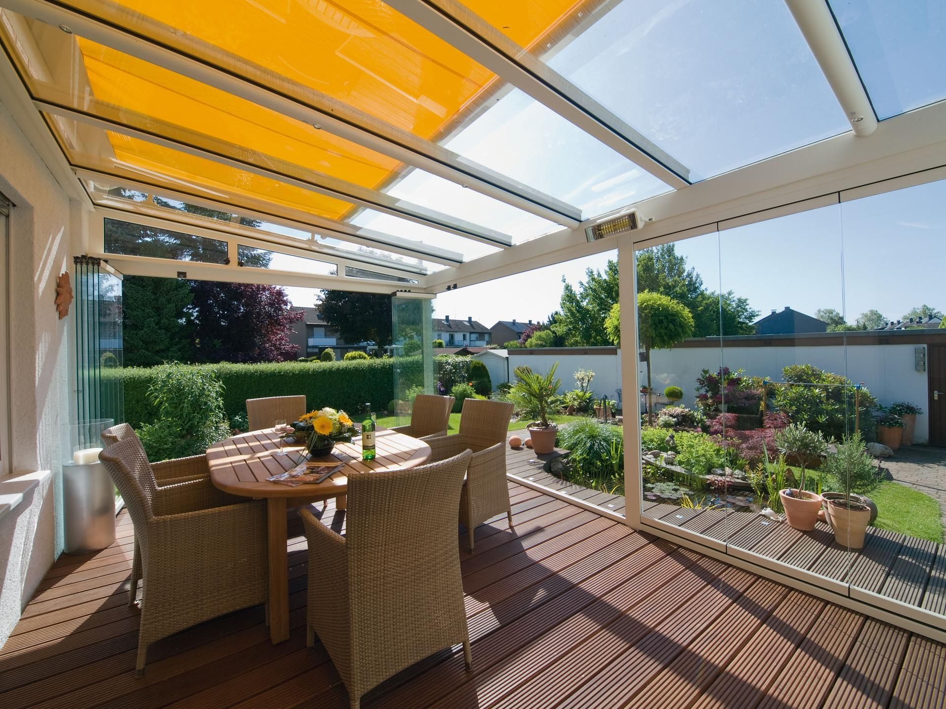 A patio with a table and chairs under a canopy