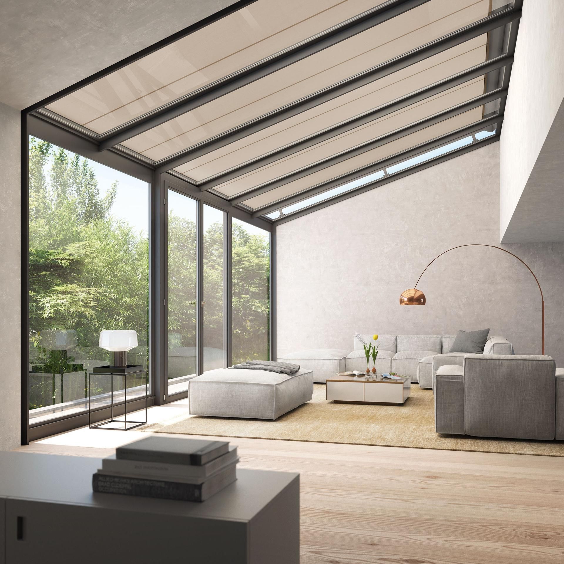 A living room with a lot of windows and furniture