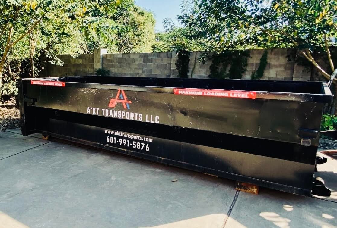 A photo of a black 15 yard dumpster rental.