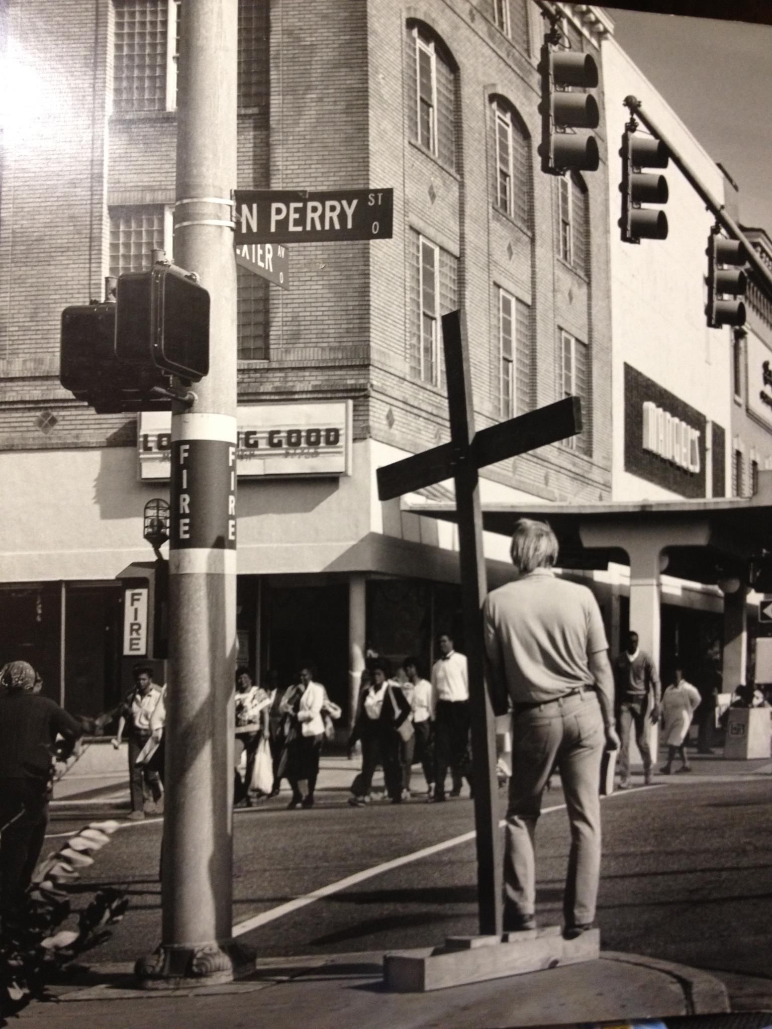 A black and white photo of a cross on perry street