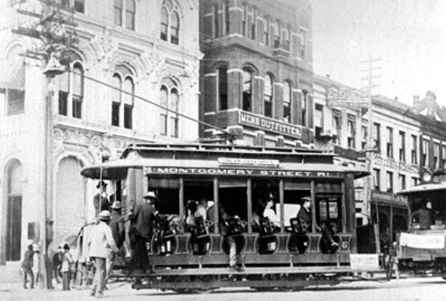 A black and white photo of a trolley on montgomery street