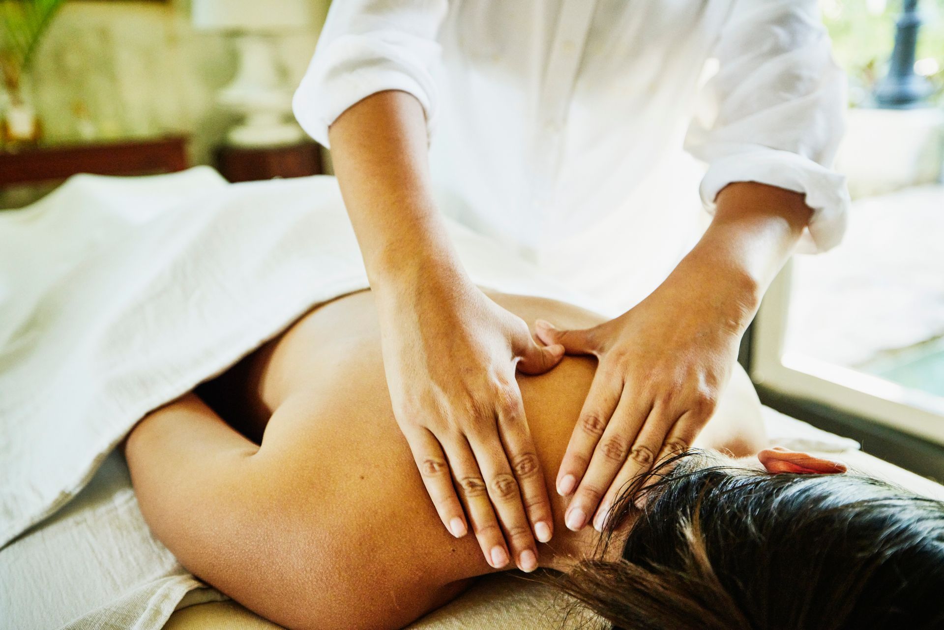 Close up shot of woman receiving massage.