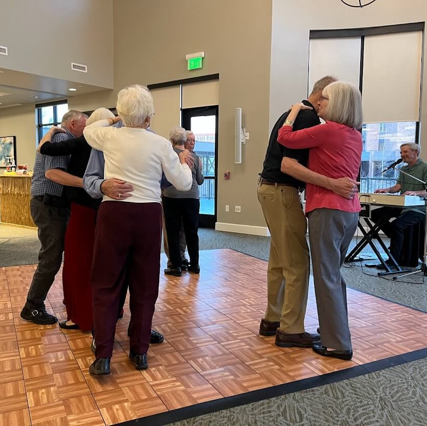 senior residents dancing on the dance floor at the community spring dance