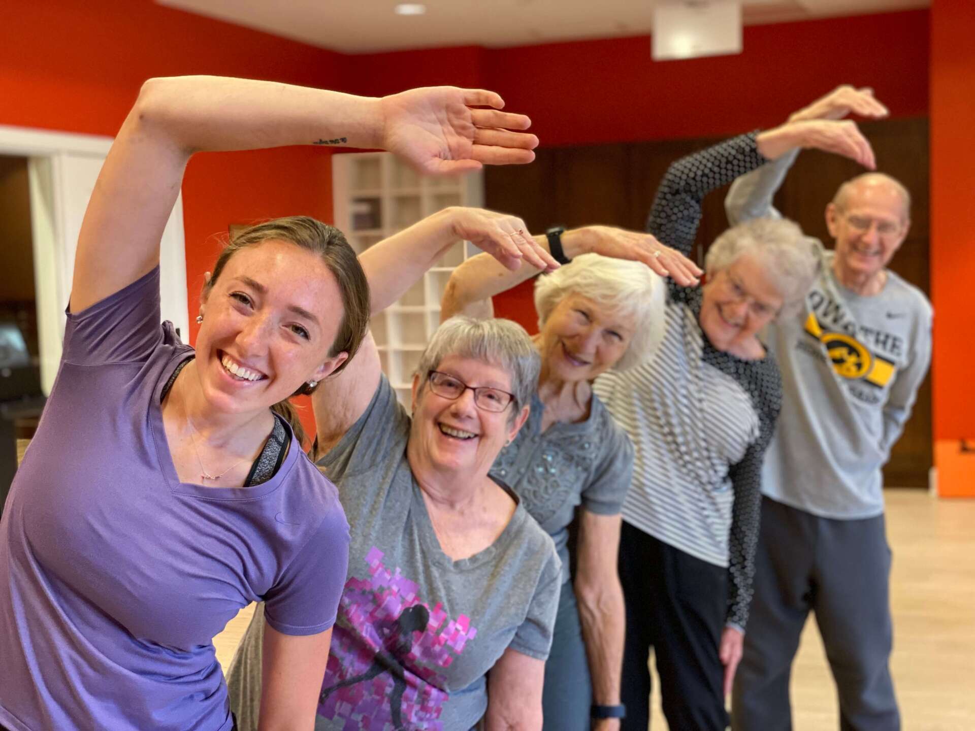 group fitness class stretching together after a work out in the fitness room of Village Terrace