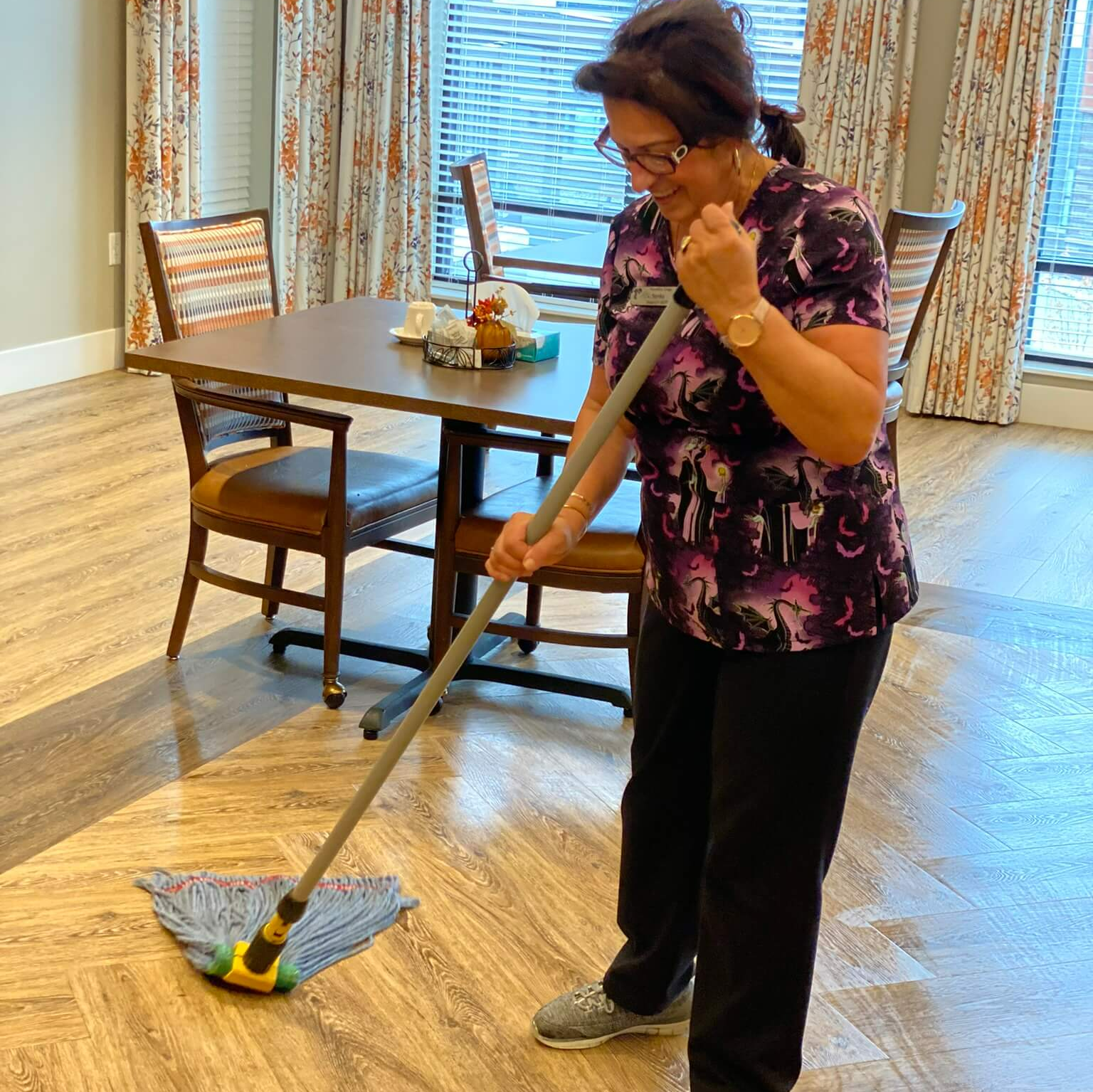 housekeepers sweeping up dust on the floor