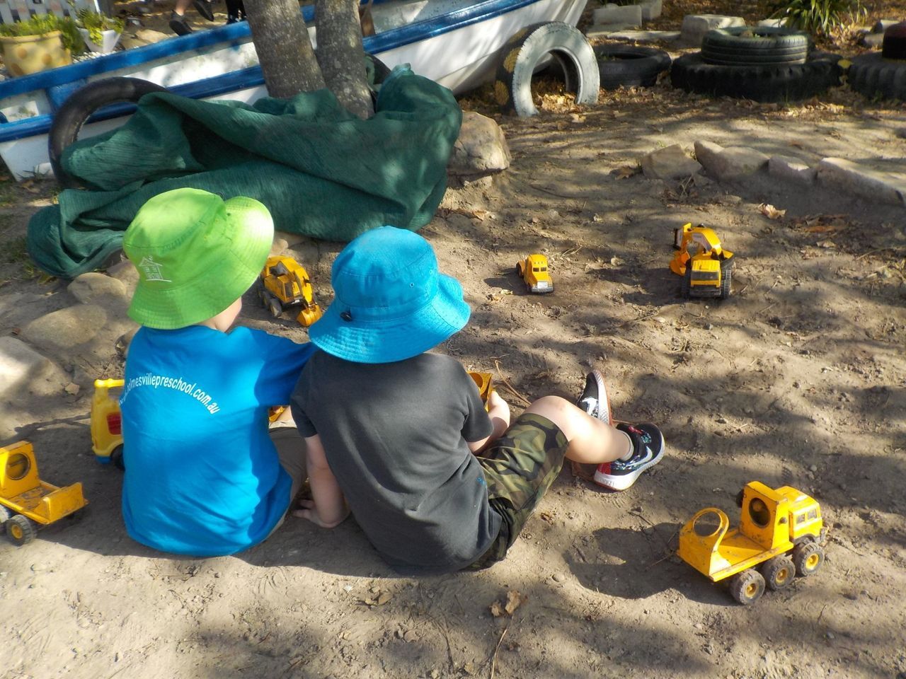 Young Boy Playing with Toy Trucks — Holmesville, NSW — Holmesville Playhouse Preschool