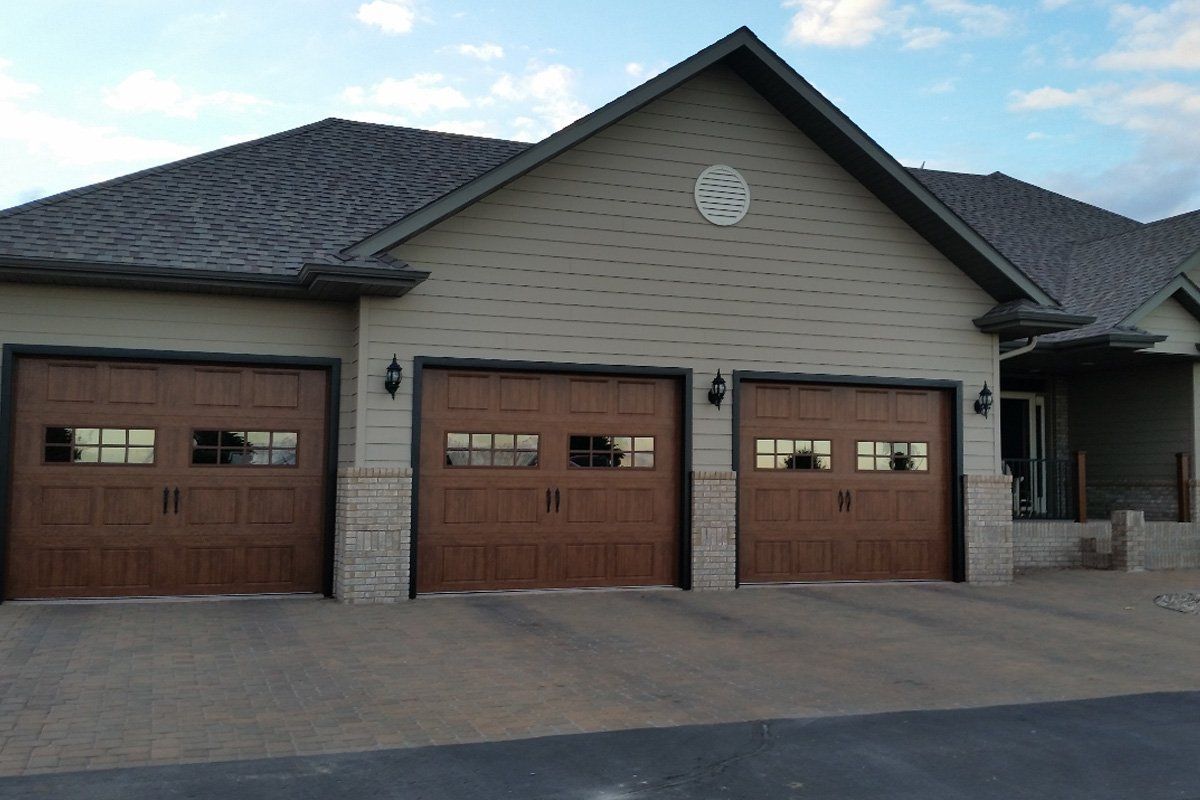 Brown House with Garage Door — Aberdeen, SD — Dakota Doors Inc.