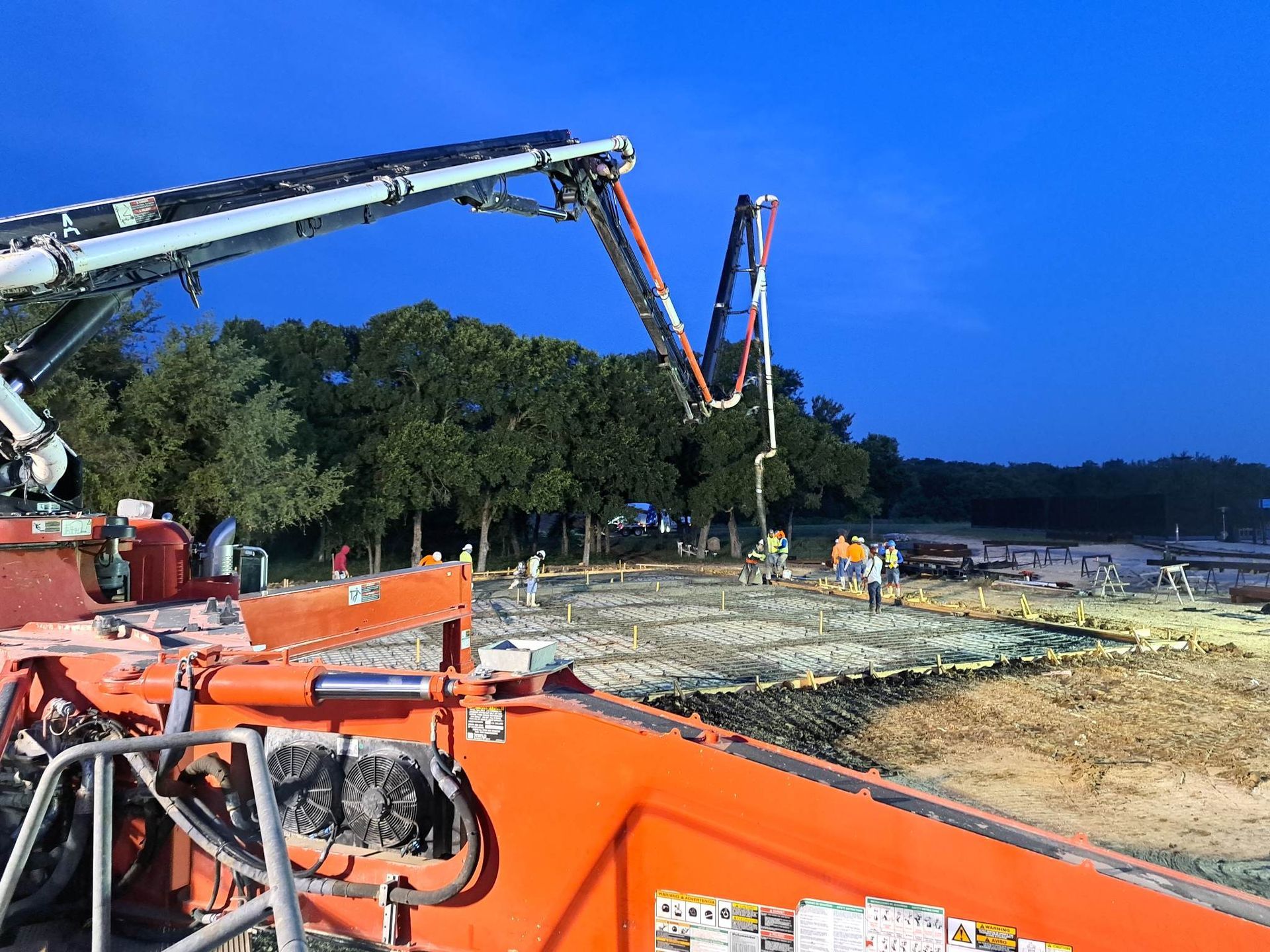 A concrete pump is being used on a construction site