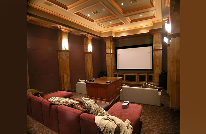 A home theater with a large screen and a couch