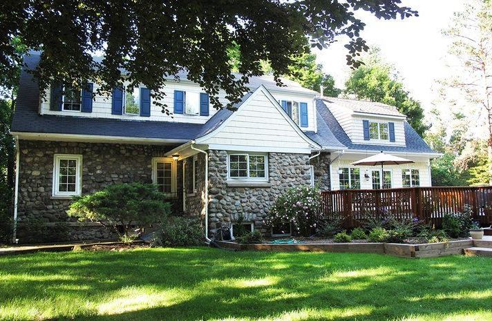 A large house with a large lawn in front of it