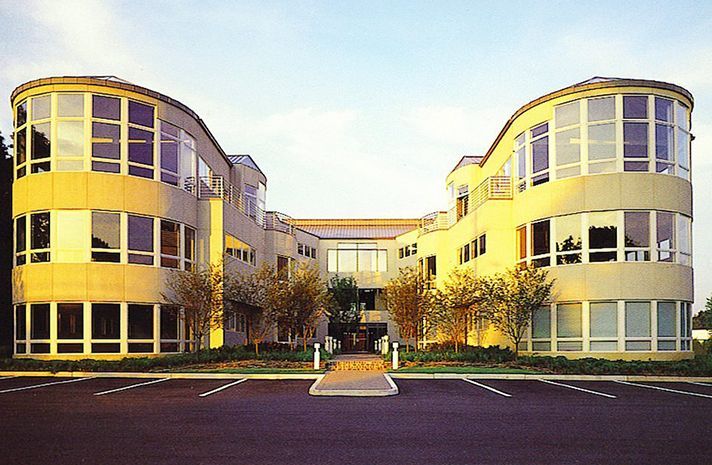 A large yellow building with a lot of windows