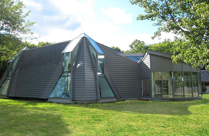A pyramid shaped building with a lot of windows