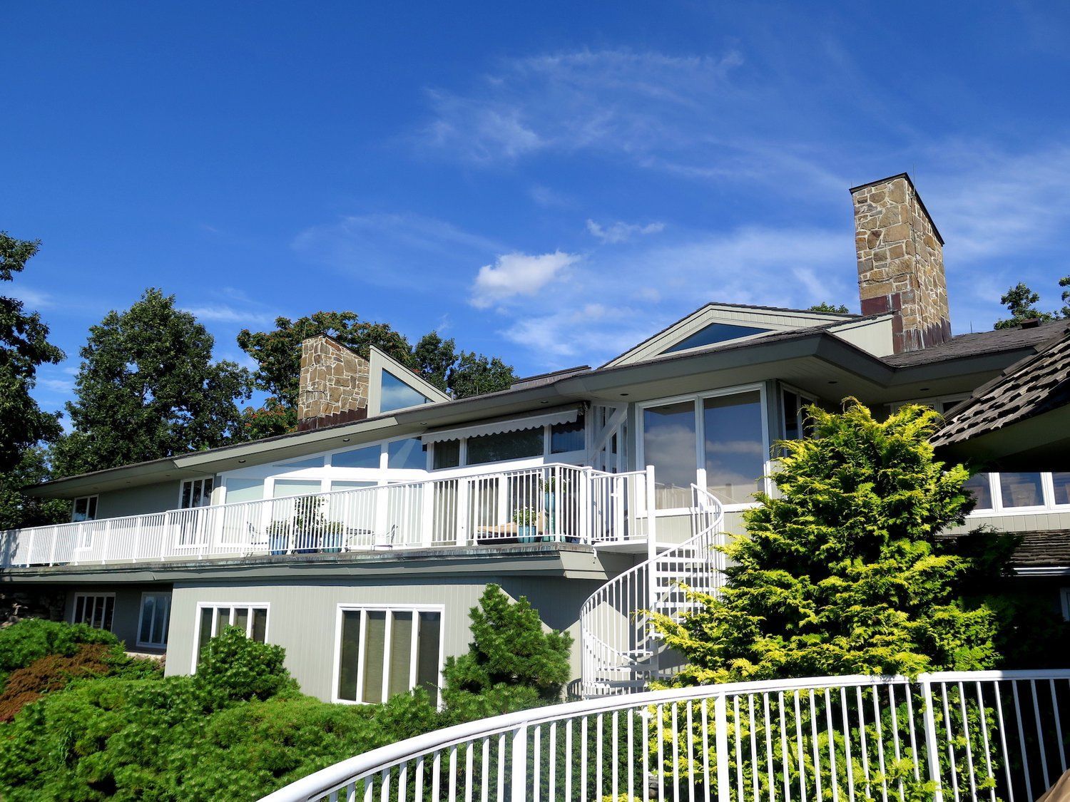 A large house with a lot of windows and a balcony