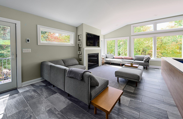 A living room with a couch and a fireplace
