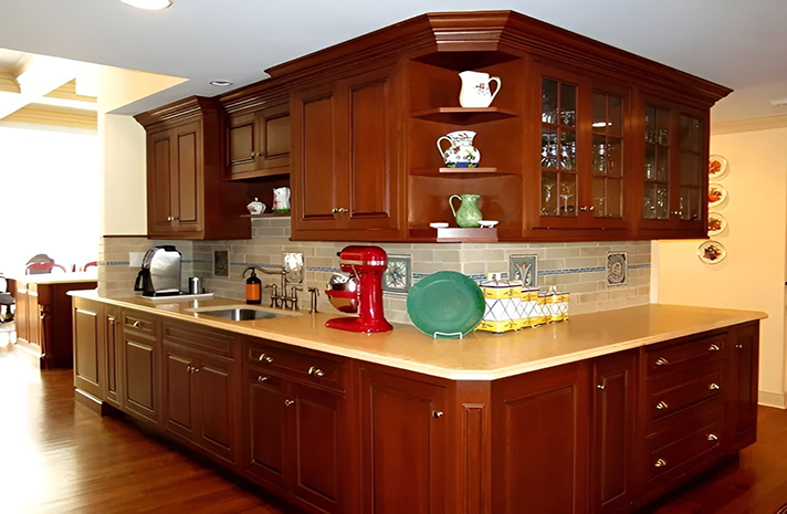 A kitchen with a red mixer on the counter