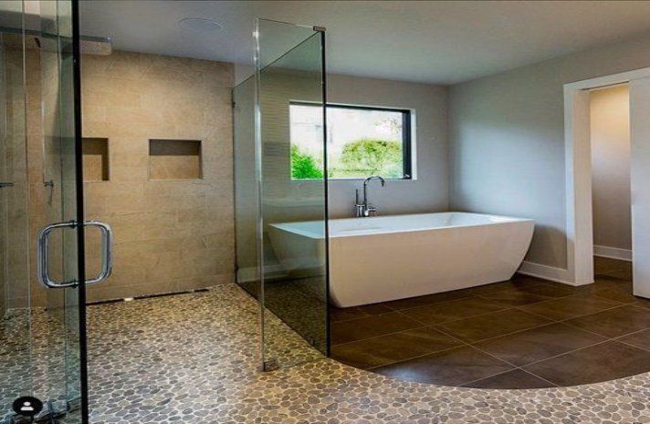 A bathroom with a bathtub and a walk in shower