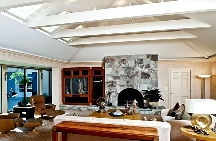 A living room with a fireplace and a couch