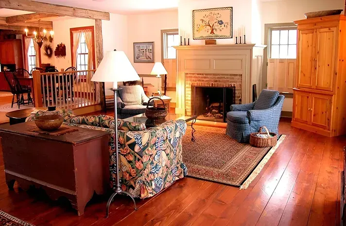 A living room filled with furniture and a fireplace