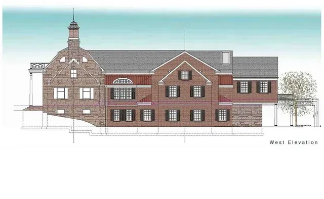 An architectural drawing of a large brick building