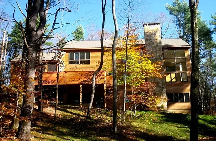 A large house in the middle of a forest