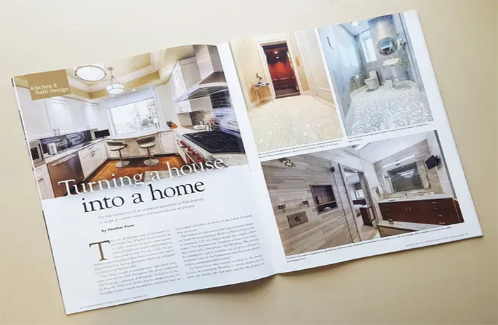 A magazine is open to a page about turning a house into a home.