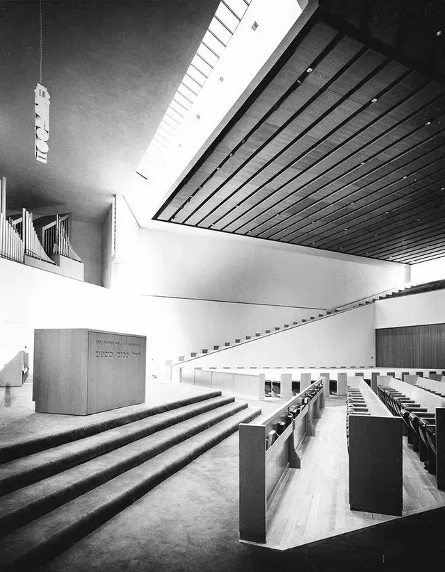 A black and white photo of the inside of a church