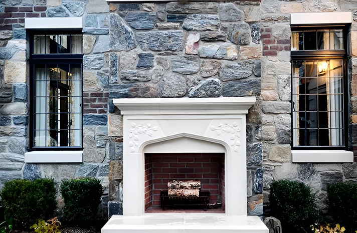 A stone wall with a fireplace in front of it