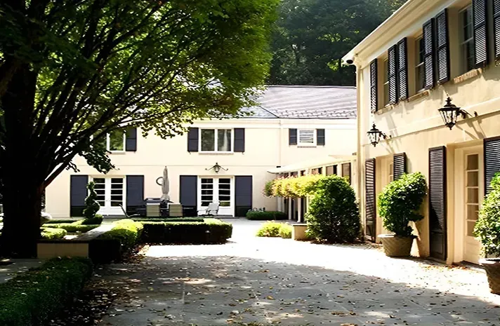 A large house with a driveway leading to it