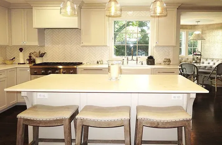 There is a large island in the middle of the kitchen.