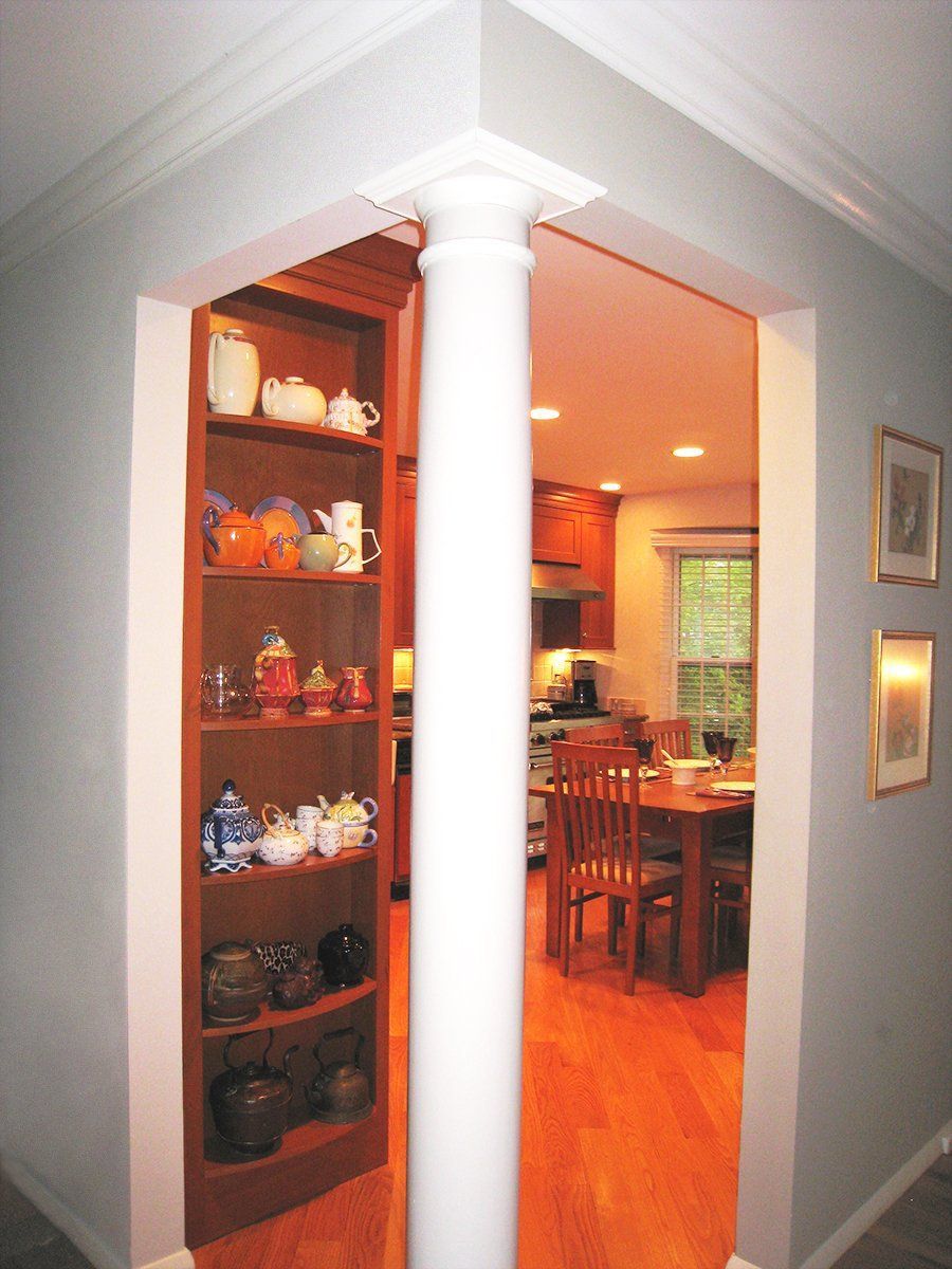 A hallway leading to a kitchen and dining room