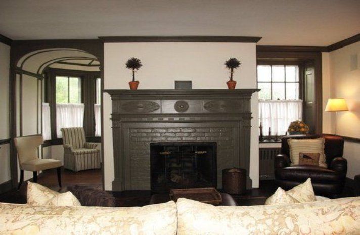 A living room with a fireplace and a couch