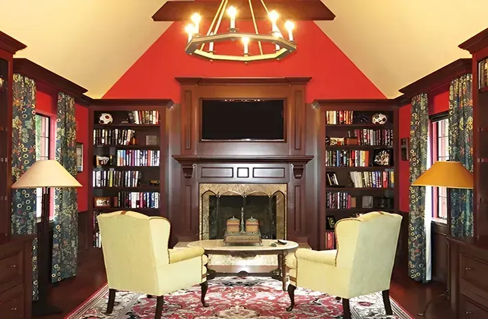 A living room with two chairs and a fireplace